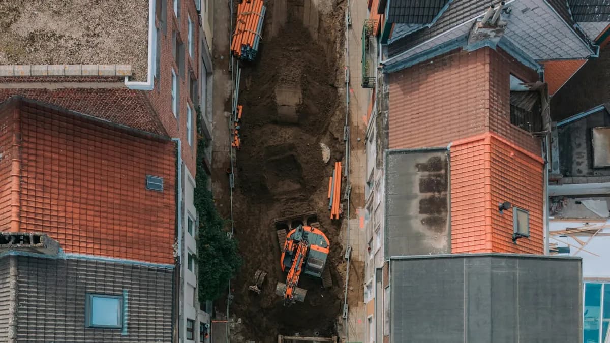 Modern construction site with digital overlay representing AI and technology integration