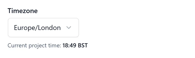 The Timezone field in the General tab of Project settings, a dropdown reading Europe/London, with a line underneath reading Current project time followed by the time in BST.