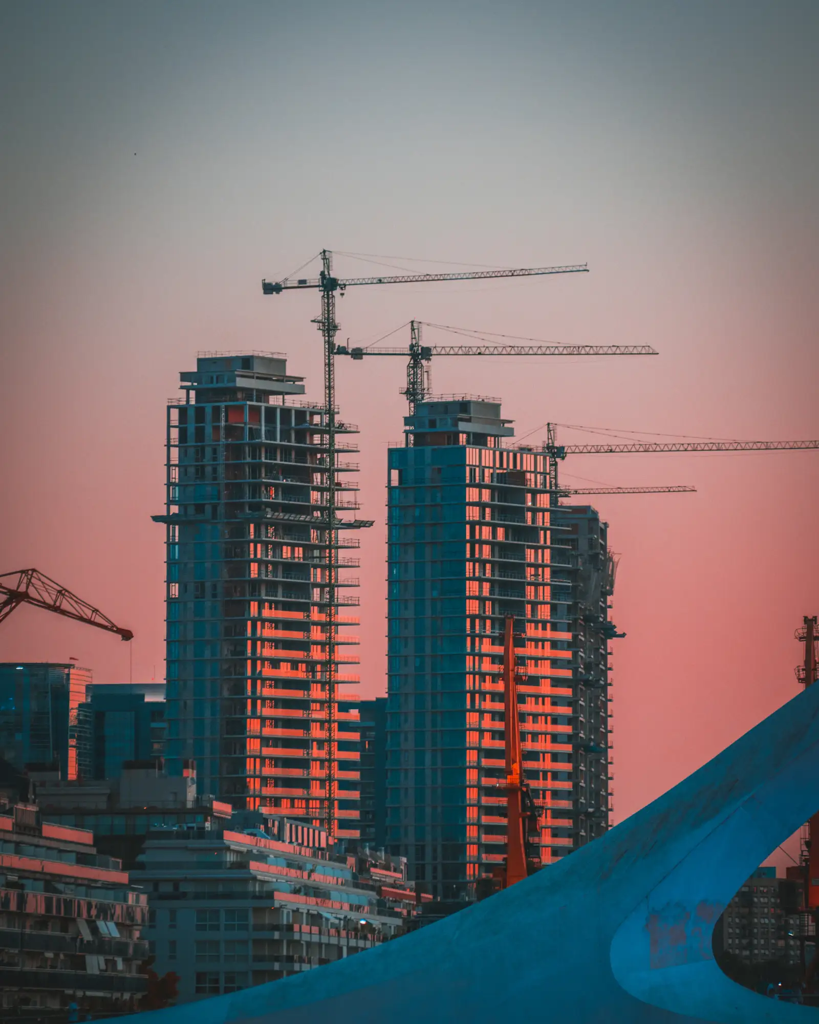 Construction crane at dusk on a UK site